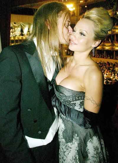  Celebrity Couples on Actress Pamela Anderson Receives A Peck On The Cheek From Boyfriend